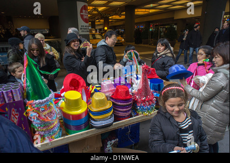 Crowds buy paraphernalia for New year's Eve in Times Square in New York Stock Photo