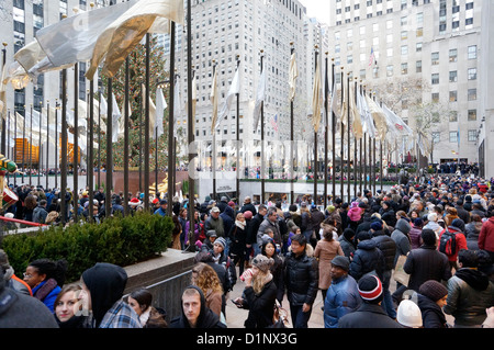 Tourists come to see the tree at Rockefeller Center every Christmas in New York City, NY. Stock Photo