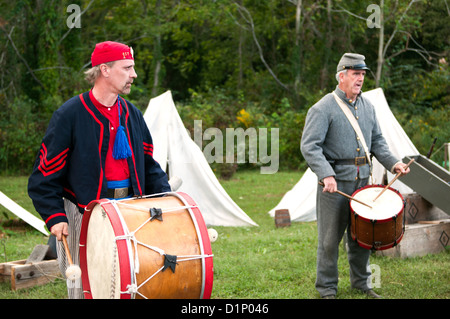 Two men dressed as US Civil War Confederate soldiers drumming at an encampment at the Virginia State Fair in Richmond Virginia. Stock Photo