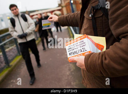 BRISTOL, UK, 2nd January 2013. Protestors outside Temple Meads station in Bristol hand out fliers to commuters highlighting the #farefail campaign organised by Together for Transport. As many people return to work following the Christmas break they will see their rail fare increase by an average of 4.2% - with the highest increase of 9.2% for the Banbury to London service. Credit:  Adam Gasson / Alamy Live News Stock Photo