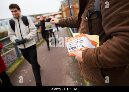 BRISTOL, UK, 2nd January 2013. Protestors outside Temple Meads station in Bristol hand out fliers to commuters highlighting the #farefail campaign organised by Together for Transport. As many people return to work following the Christmas break they will see their rail fare increase by an average of 4.2% - with the highest increase of 9.2% for the Banbury to London service. Credit:  Adam Gasson / Alamy Live News Stock Photo