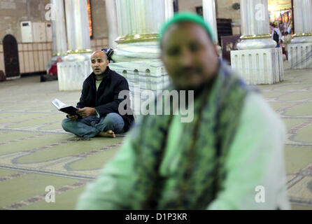 Jan. 1, 2013 - Cairo, Cairo, Egypt - Egyptian Muslims pray at a tomb in al-Hussein mosque, which according to the belief head of Imam Hussein, the grandson of prophet Mohammed, is buried, in the old city of Cairo on Jan. 1, 2013  (Credit Image: © Ashraf Amra/APA Images/ZUMAPRESS.com) Stock Photo