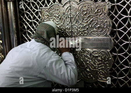 Jan. 1, 2013 - Cairo, Cairo, Egypt - Egyptian Muslims pray at a tomb in al-Hussein mosque, which according to the belief head of Imam Hussein, the grandson of prophet Mohammed, is buried, in the old city of Cairo on Jan. 1, 2013  (Credit Image: © Ashraf Amra/APA Images/ZUMAPRESS.com) Stock Photo