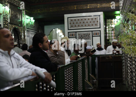 Jan. 1, 2013 - Cairo, Cairo, Egypt - Egyptian Muslims pray at a tomb in al-Hussein mosque, which according to the belief head of Imam Hussein, the grandson of prophet Mohammed, is buried, in the old city of Cairo on Jan. 1, 2013  (Credit Image: © Ashraf Amra/APA Images/ZUMAPRESS.com) Stock Photo