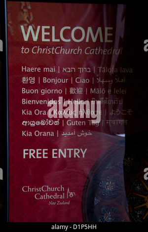 Multi-lingual sign inviting visitors into the Anglican cathedral of Christ Church in the city of Christchurch, New Zealand. Stock Photo