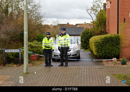 Police Community Support Officers (PCSO) guard the scene of a murder of Janee Parson in Lucerne Avenue, Bicester Stock Photo