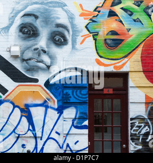 Graffiti covered wall of a building, Le Plateau-Mont-Royal, Montreal, Quebec, Canada Stock Photo