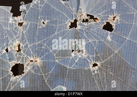 Smashed window in an abandoned industrial building Stock Photo