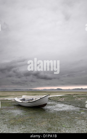 Marine landscape with a white boat and stormy sky Stock Photo