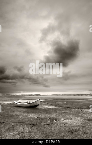 Marine landscape with a white boat and stormy sky Stock Photo