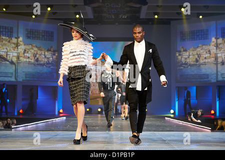 Models walk down the catwalk during the Fashion Theatre show at the Clothes Show Live event being held in the NEC, Birmingham Stock Photo