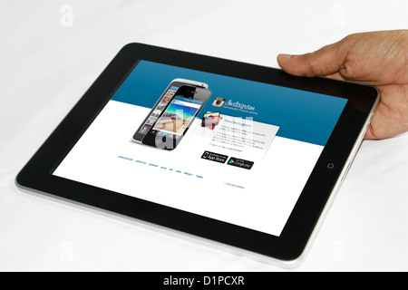 A person using Apple iPad tablet computer Stock Photo