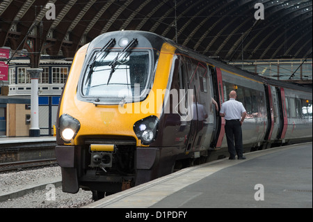 Class 220 Voyager passenger train in CrossCountry livery waiting at a platform at York Railway Station, England. Stock Photo