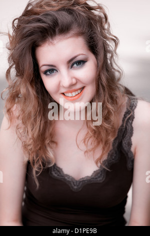 Portrait of young caucasian woman outdoor, warm light. Stock Photo