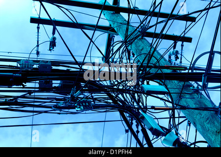 Overhead wire cables hanging horizontal on power lines Stock Photo