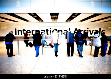 People waiting at International Arrivals, Heathrow, Terminal 5, LHR Stock Photo