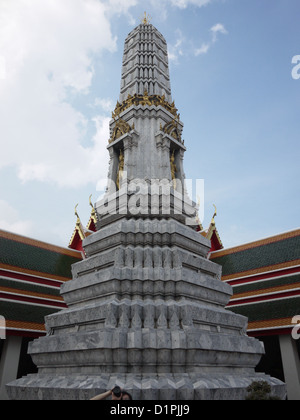 A prang is a tall tower-like spire, usually richly carved.  It is common shrine element of Buddhist architecture. Stock Photo