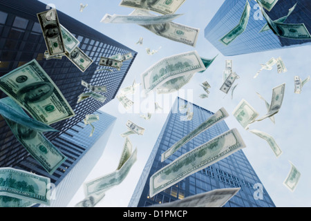One hundred dollar bills falling from sky Stock Photo