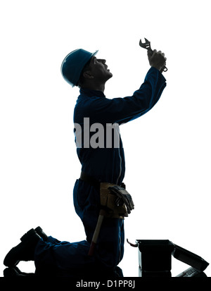 one  repairman worker despair praying silhouette in studio on white background Stock Photo