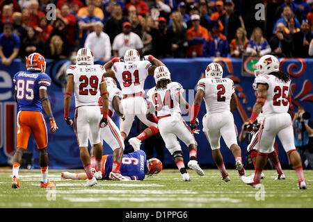 Jan. 2, 2013 - New Orleans, Florida, U.S. - WILL VRAGOVIC | Times.ot 364261 vrag sugar  of (1/2/13 New Orleans, LA.) Louisville Cardinals defensive end Marcus Smith (91) celebrates sacking Florida Gators quarterback Jeff Driskel (6) during the first half of the Allstate Sugar Bowl in the Mercedes-Benz Superdome on Wednesday, January 2 in New Orleans. (Credit Image: © Will Vragovic/Tampa Bay Times/ZUMAPRESS.com) Stock Photo