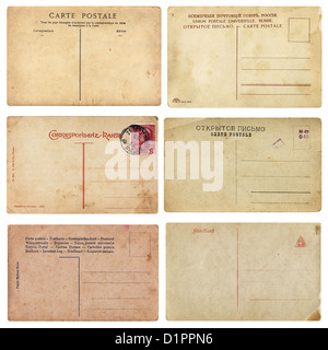 Set of aged vintage postcards from early 1900s. Comes on white background, isolated with clipping path. Stock Photo