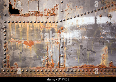 Metal industrial background with rivets and rust Stock Photo