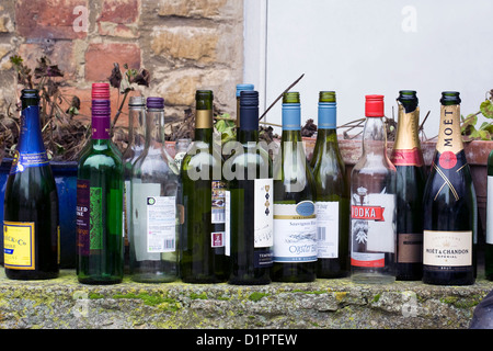 Empty glass bottles ready for recycling after New Year party. Stock Photo