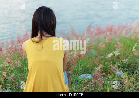 Portrait of young beautiful girl with flowers Stock Photo