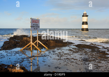 Danger sign warning of no access to Black Nose lighthouse offshore at Penmon Point (Trwyn Du), Isle of Anglesey (Ynys Mon), North Wales, UK, Britain Stock Photo