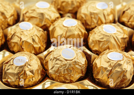 Ferrero Rocher luxury chocolates in gold foil wrapping. England UK Britain Stock Photo