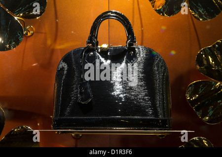 Louis Vuitton bag displayed in store window showcase Stock Photo