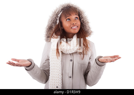 Young african american woman wearing winter clothes holding something in her hand, isolated on white background Stock Photo