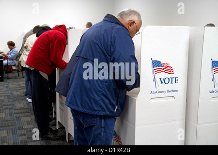 People vote in cardboard voting booths at a polling station in Boise, Idaho, USA. Stock Photo