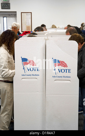 People vote in cardboard voting booths at a polling station in Boise, Idaho, USA. Stock Photo