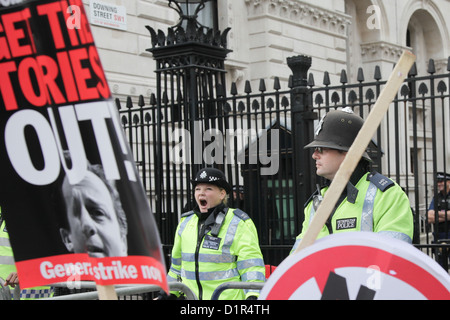 Police guarding Downing Street 10. 10s of thousands turned out to demonstrate against the Government's cuts. Stock Photo