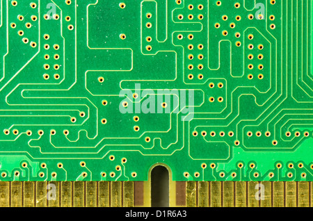 A closeup of a printed circuit board with gold contacts Stock Photo