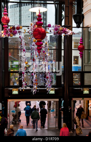 Christmas Decorations & festive trimmings, shops and xmas shoppers at St. Georges Shopping Centre & mall, 92 Fishergate Walk, Preston, Lancashire, UK Stock Photo