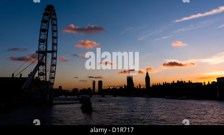 London: Sunset of London eye and Westminster from Embankment Bridge Stock Photo