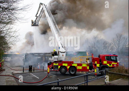 Laindon, Basildon, Essex, 3rd January 2013. Four shops in a parade known as the Triangle Shops were destroyed in a severe fire that was believed to have been caused by an electrical fault in a vent.  The fish and chip shop, the Chinese take away, the hairdressers and the McColl convenience store were totally destroyed. Four pumps from the Essex Fire Service tackled the blaze. It is believed that no-one was injured. Stock Photo