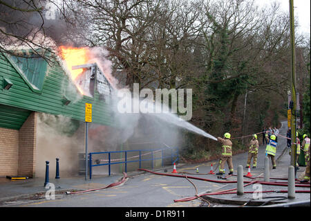 Laindon, Basildon, Essex, 3rd January 2013. Four shops in a parade known as the Triangle Shops were destroyed in a severe fire that was believed to have been caused by an electrical fault in a vent.  The fish and chip shop, the Chinese take away, the hairdressers and the McColl convenience store were totally destroyed. Four pumps from the Essex Fire Service tackled the blaze. It is believed that no-one was injured. Stock Photo