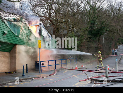 Laindon, Basildon, Essex, 3rd January 2013. Four shops in a parade known as the Triangle Shops were destroyed in a severe fire that was believed to have been caused by an electrical fault in a vent.  The fish and chip shop, the Chinese take away, the hairdressers and the McColl convenience store were totally destroyed. Four pumps from the Essex Fire Service tackled the blaze. It is believed that no-one was injured. Stock Photo