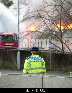 Laindon, Basildon, Essex, 3rd January 2013. Four shops in a parade known as the Triangle Shops were destroyed in a severe fire that was believed to have been caused by an electrical fault in a vent.  The fish and chip shop, the Chinese take away, the hairdressers and the McColl convenience store were totally destroyed. Four pumps from the Essex Fire Service tackled the blaze. It is believed that no-one was injured. Stock Photo