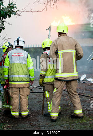 Laindon, Basildon, Essex, 3rd January 2013. Four shops in a parade known as the Triangle Shops were destroyed by fire that was believed to have been caused by an electrical fault in a vent.  The fish and chip shop, the Chinese take away, the hairdressers and the McColl convenience store were totally destroyed. Four pumps from the Essex Fire Service tackled the blaze. It is believed that no-one was injured. Stock Photo