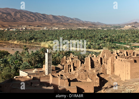 Morocco, near Agdz, Village, kasbah and oasis with date palm trees. Stock Photo