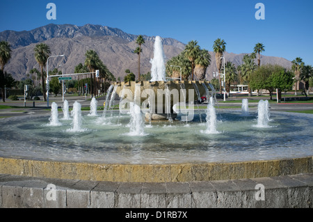 Color photograph of fountain in front of Palm Springs International Airport with San Jacinto Mountains in background. Stock Photo
