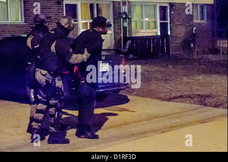 Police and Swat Team are arresting a man for alleged Robery Stock Photo ...