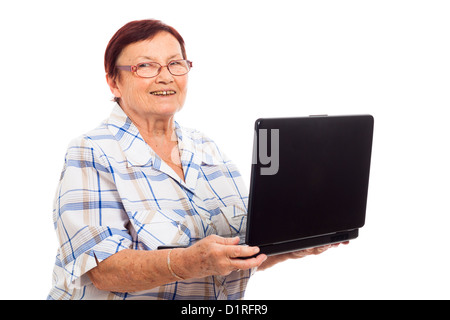 Portrait of happy senior woman holding laptop, isolated on white background. Stock Photo