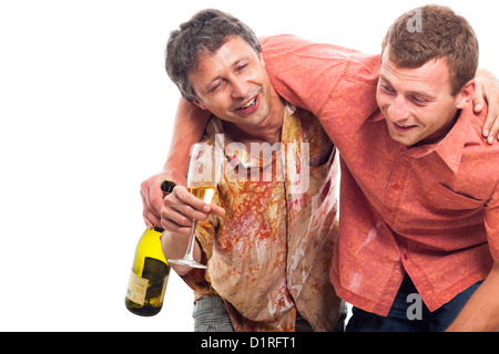 Two drunken men laughing with bottle and glass of alcohol, isolated on white background with copy space. Stock Photo