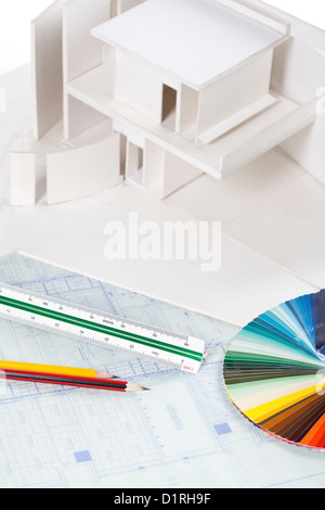 Architectural model with other stationery on blueprints Stock Photo