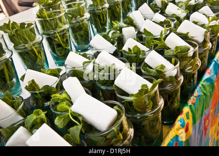 Morocco, Marrakech, Glasses with sugar and fresh mint for mint tea. Stock Photo